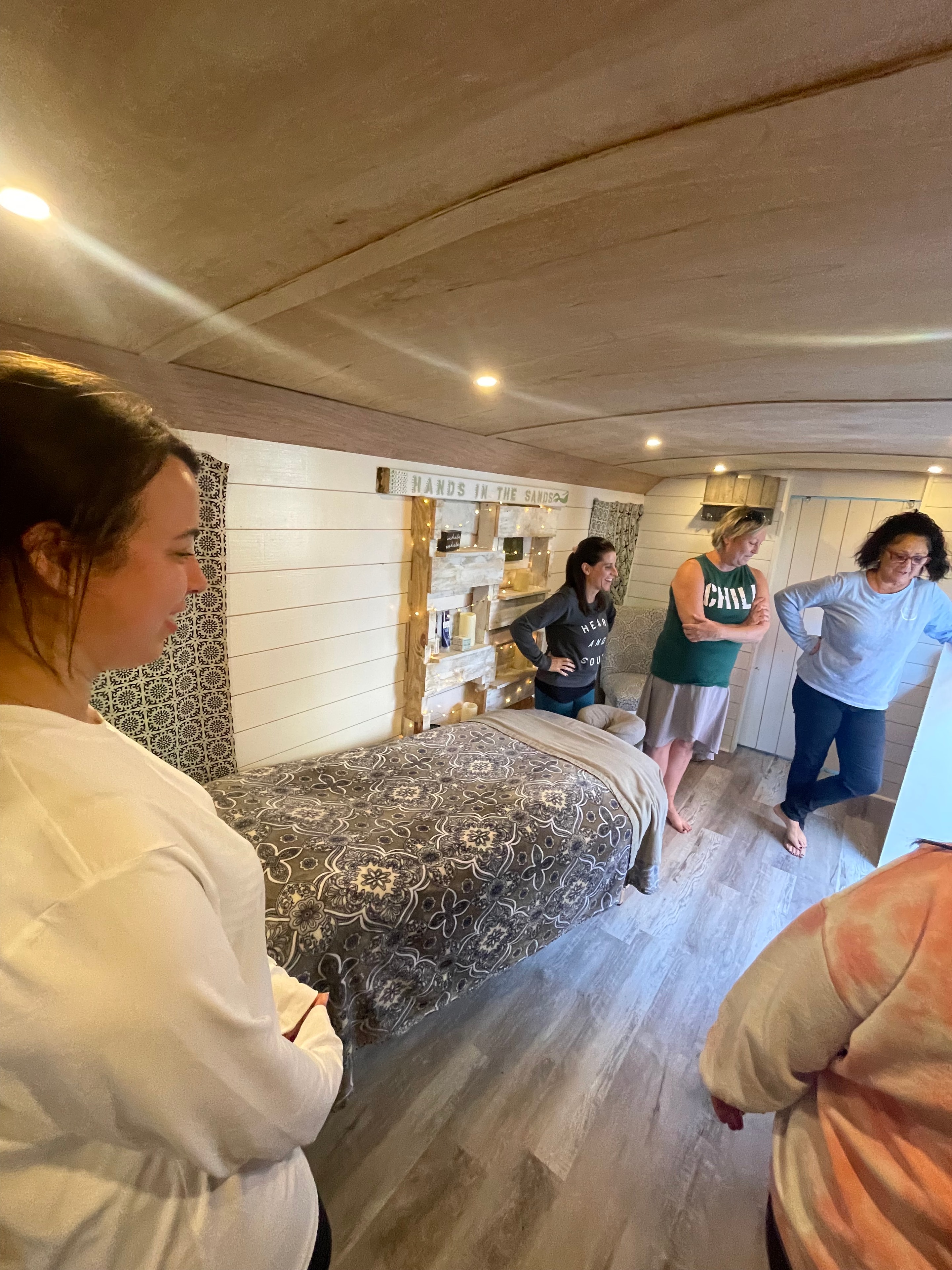 Group massage session inside the Hands in the Sands studio