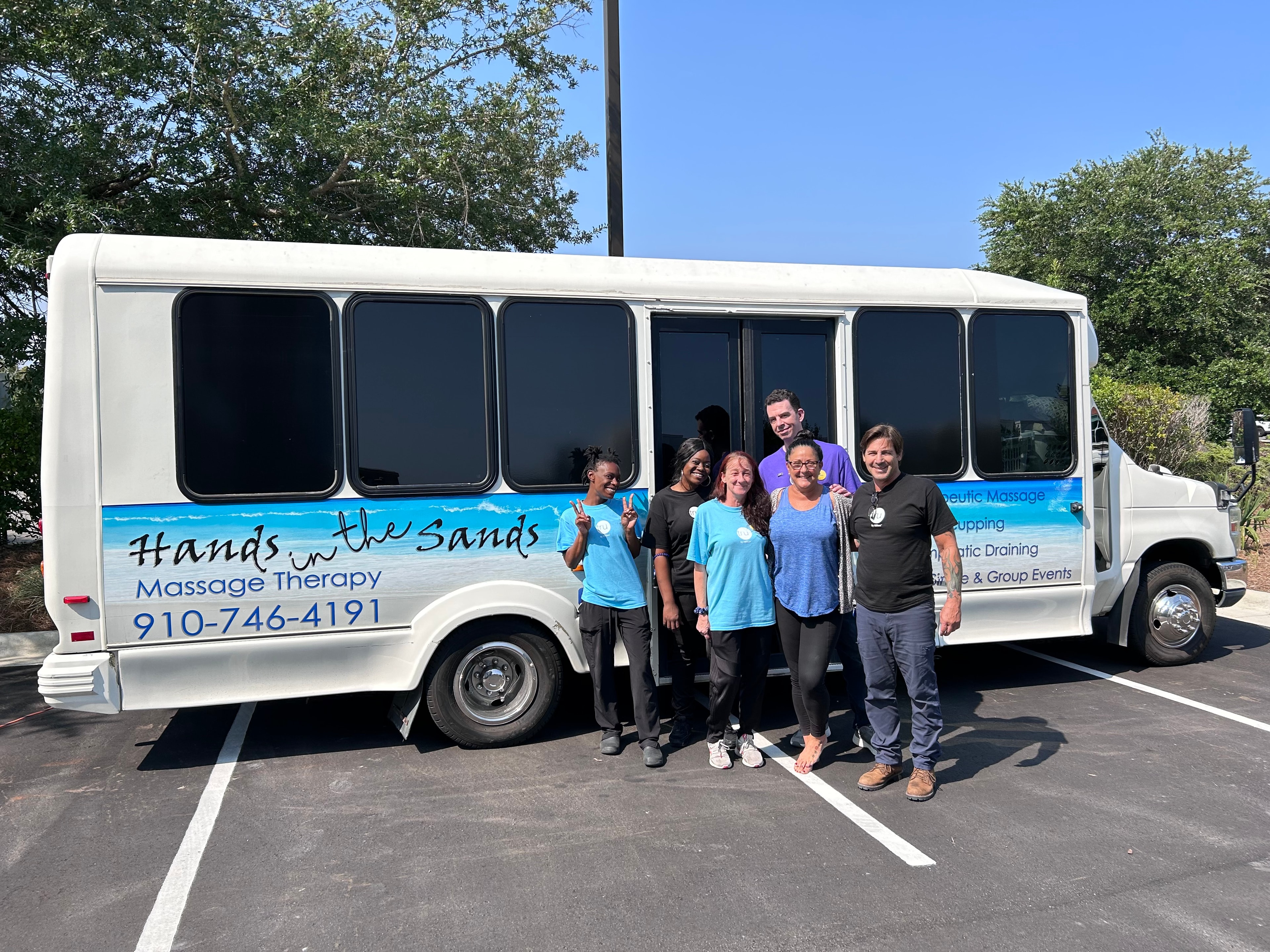 The Hands in the Sands team in front of the studio bus