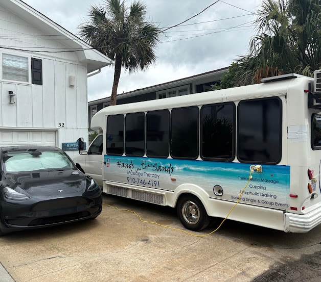 The Hands in the Sands mobile studio parked outside a beach rental house